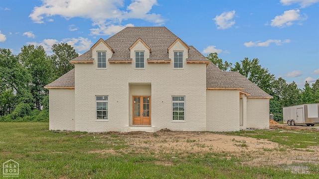 149 County Road 7127, Jonesboro, AR 72405 - back of house featuring a shingled roof and a lawn