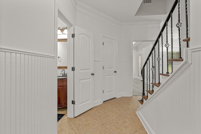 2207 Byrnewood, Jonesboro, AR 72404 - foyer entrance featuring ornamental molding, light tile patterned floors, and stairway