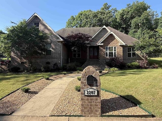2207 Byrnewood, Jonesboro, AR 72404 - view of front of property with brick siding and a front lawn
