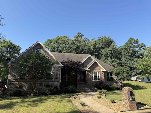 2207 Byrnewood, Jonesboro, AR 72404 - view of front facade with a front yard and brick siding