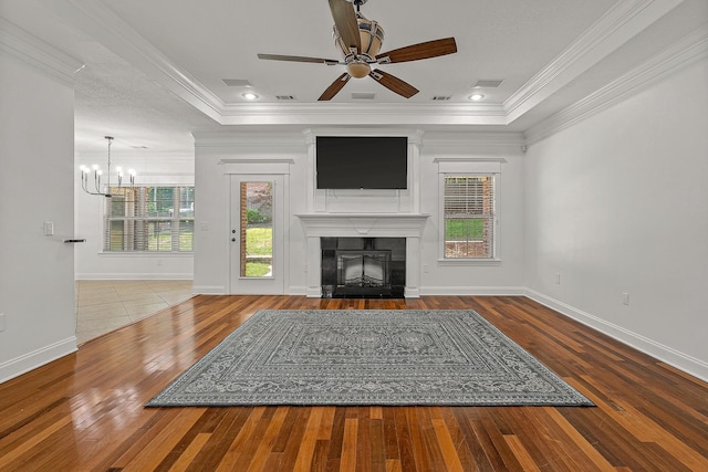 2207 Byrnewood, Jonesboro, AR 72404 - unfurnished living room featuring a chandelier, wood-type flooring, a fireplace, a ceiling fan, and ornamental molding