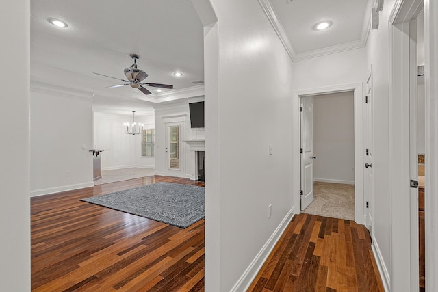2207 Byrnewood, Jonesboro, AR 72404 - hallway featuring ornamental molding, hardwood / wood-style floors, baseboards, a chandelier, and recessed lighting