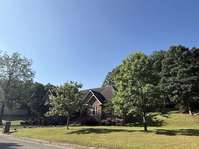 2207 Byrnewood, Jonesboro, AR 72404 - view of front facade featuring a front yard and brick siding