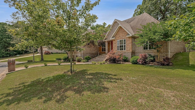 2207 Byrnewood, Jonesboro, AR 72404 - view of front facade with brick siding and a front yard