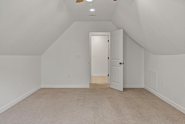2207 Byrnewood, Jonesboro, AR 72404 - additional living space featuring light colored carpet, vaulted ceiling, ceiling fan, and baseboards