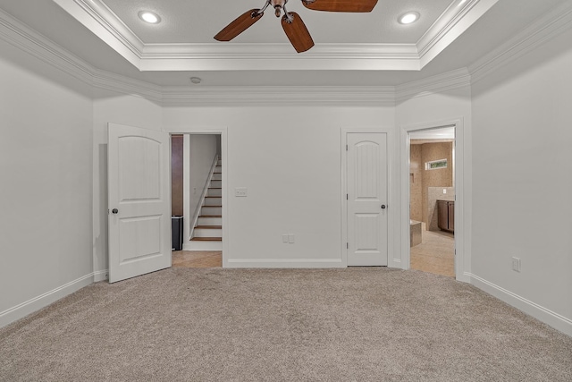 2207 Byrnewood, Jonesboro, AR 72404 - unfurnished bedroom with ornamental molding, light colored carpet, a raised ceiling, baseboards, and ensuite bath