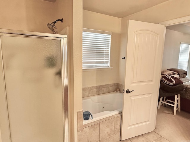 113 Harmony Loop, Maumelle, AR 72113 - bathroom featuring a shower stall, a jetted tub, and tile patterned flooring