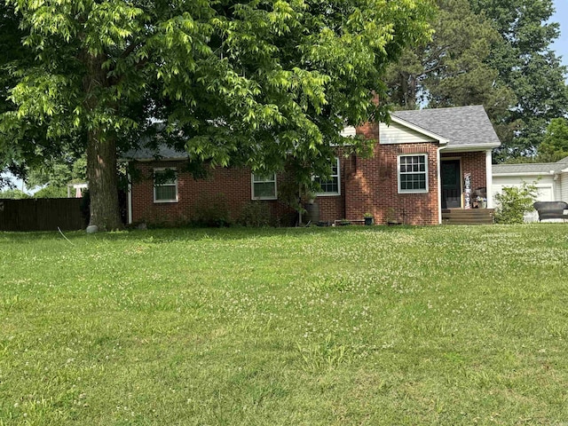 821 S 12th Ave, Piggott, AR 72454 - view of front of home featuring brick siding and a garage
