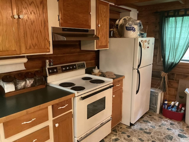 1602 Lake Clf, Higden, AR 72067 - kitchen with white appliances, under cabinet range hood, brown cabinetry, and stone finish floors