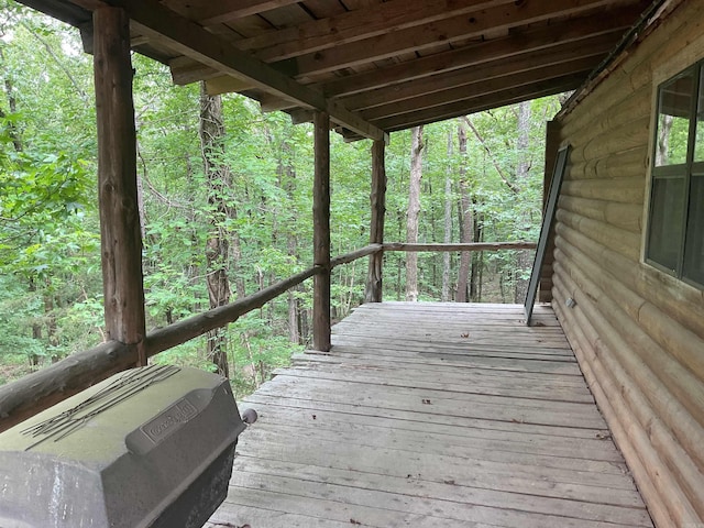 1602 Lake Clf, Higden, AR 72067 - wooden deck with area for grilling and a forest view