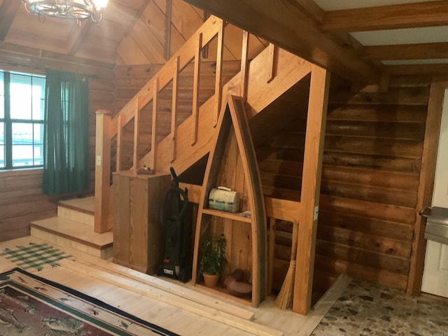 1602 Lake Clf, Higden, AR 72067 - staircase featuring vaulted ceiling and a chandelier