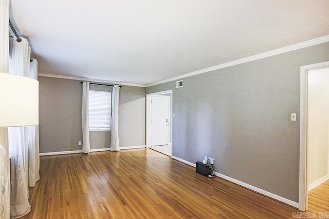 5 Brookridge Dr, Little Rock, AR 72205 - unfurnished room with ornamental molding, wood finished floors, and baseboards