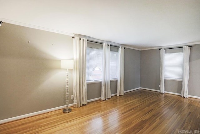 5 Brookridge Dr, Little Rock, AR 72205 - spare room featuring wood finished floors, baseboards, and ornamental molding