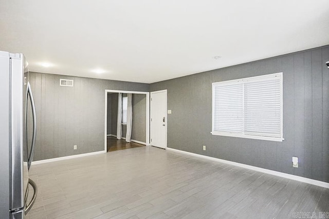 5 Brookridge Dr, Little Rock, AR 72205 - unfurnished room with wood finished floors, wood walls, and baseboards