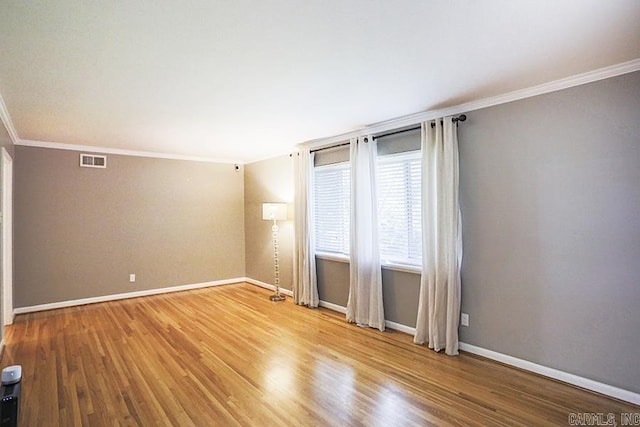 5 Brookridge Dr, Little Rock, AR 72205 - unfurnished room with ornamental molding, wood finished floors, and baseboards