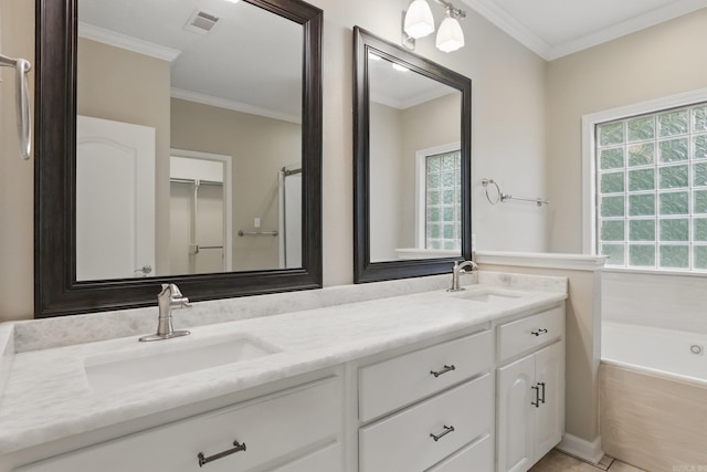 5017 Calico Creek Cv, North Little Rock, AR 72116 - full bath with double vanity, ornamental molding, and a bath