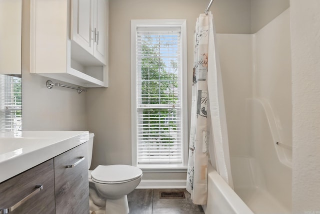 5017 Calico Creek Cv, North Little Rock, AR 72116 - bathroom with vanity, toilet, baseboards, and shower / tub combo