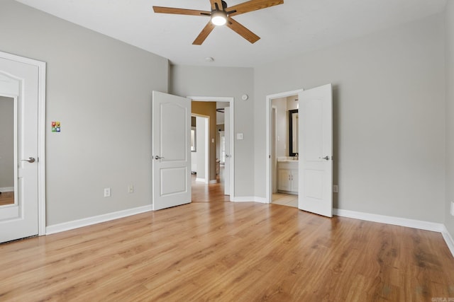 5017 Calico Creek Cv, North Little Rock, AR 72116 - unfurnished bedroom featuring light wood finished floors, ensuite bath, baseboards, and ceiling fan