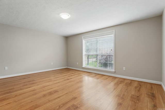 5017 Calico Creek Cv, North Little Rock, AR 72116 - spare room featuring light wood finished floors and baseboards