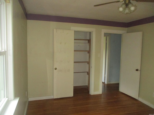 905 Merritt St, Searcy, AR 72143 - unfurnished bedroom with wood finished floors, baseboards, and a closet