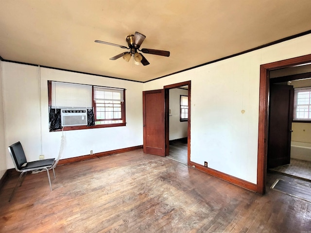 1930 S Olive, Pine Bluff, AR 71603 - empty room with cooling unit, wood finished floors, a ceiling fan, baseboards, and crown molding