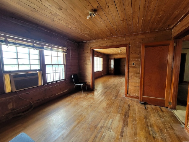 1930 S Olive, Pine Bluff, AR 71603 - empty room featuring wood ceiling, cooling unit, hardwood / wood-style flooring, and wood walls