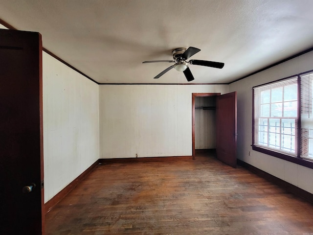 1930 S Olive, Pine Bluff, AR 71603 - unfurnished bedroom featuring wood finished floors, baseboards, ceiling fan, and crown molding
