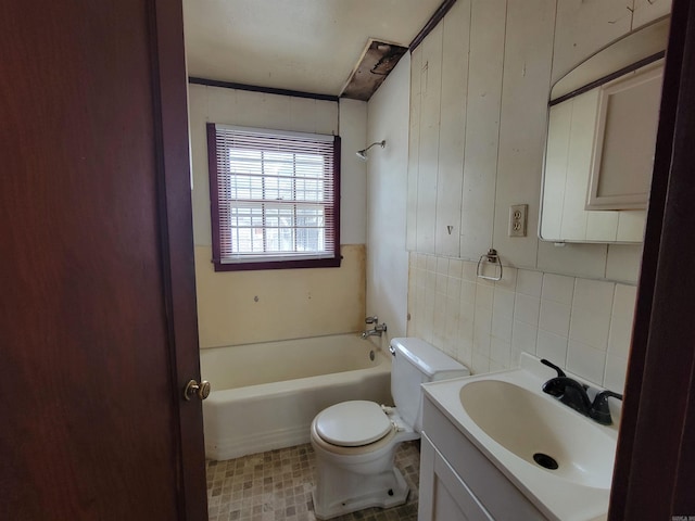 1930 S Olive, Pine Bluff, AR 71603 - bathroom featuring toilet, vanity, shower / tub combination, tile walls, and backsplash