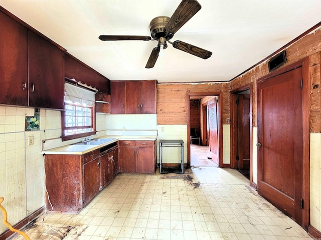 1930 S Olive, Pine Bluff, AR 71603 - kitchen with light floors, a ceiling fan, wooden walls, light countertops, and open shelves