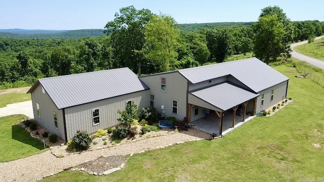 5867 County Road 4160, Ozark, AR 72949 - aerial view of property and surrounding area with a heavily wooded area