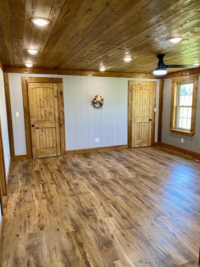 5867 County Road 4160, Ozark, AR 72949 - entryway featuring wood ceiling, wood finished floors, baseboards, a ceiling fan, and wooden walls