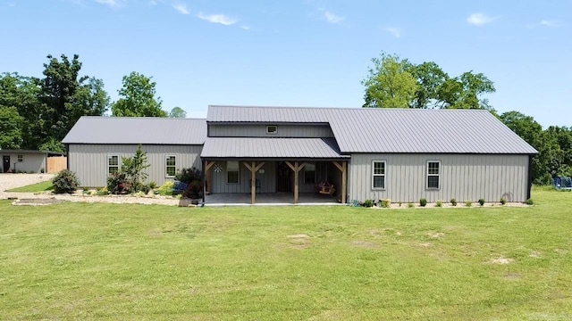 5867 County Road 4160, Ozark, AR 72949 - back of property featuring a yard, a pole building, a garage, and metal roof