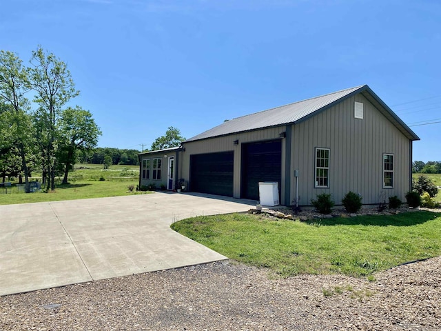 5867 County Road 4160, Ozark, AR 72949 - view of property exterior featuring a yard, board and batten siding, and metal roof