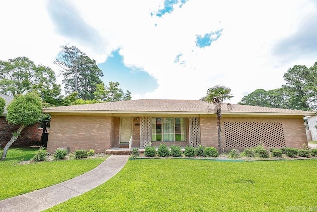 1706 W Block St, El Dorado, AR 71730 - view of front of home with a front yard and brick siding