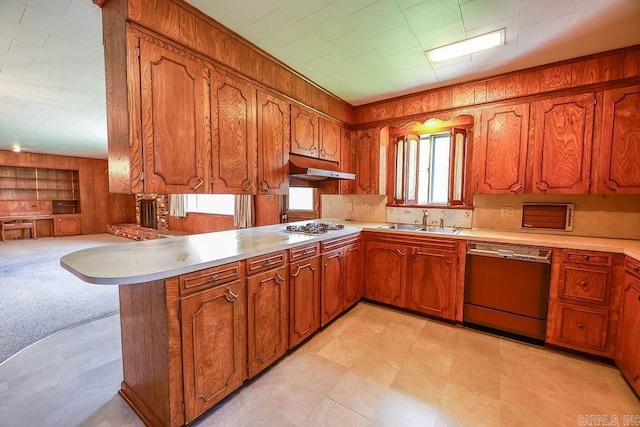 1706 W Block St, El Dorado, AR 71730 - kitchen featuring dishwashing machine, a sink, a peninsula, brown cabinetry, and wooden walls