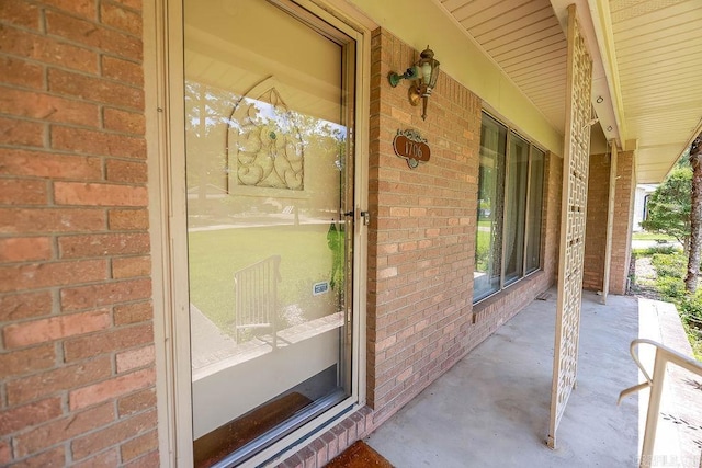 1706 W Block St, El Dorado, AR 71730 - view of exterior entry with covered porch and brick siding