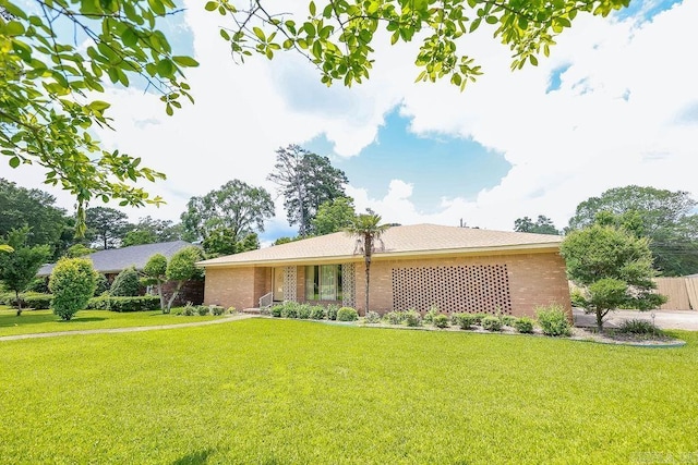 1706 W Block St, El Dorado, AR 71730 - ranch-style home with a front yard and brick siding