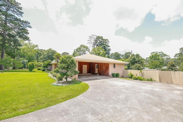 1706 W Block St, El Dorado, AR 71730 - view of front of property with driveway and a carport