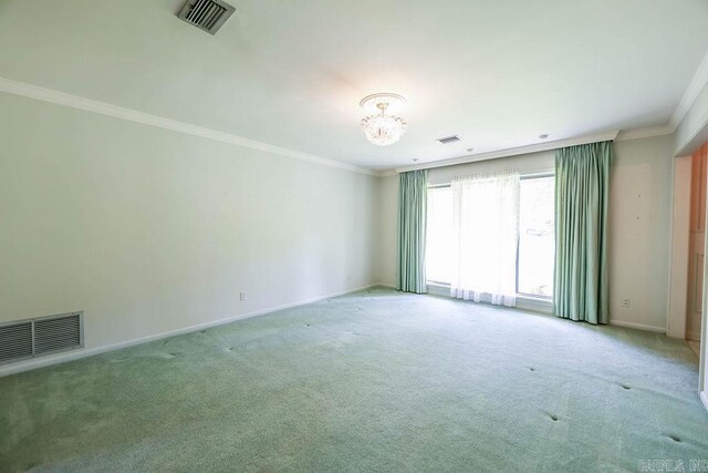 1706 W Block St, El Dorado, AR 71730 - carpeted spare room with ornamental molding, a chandelier, and baseboards