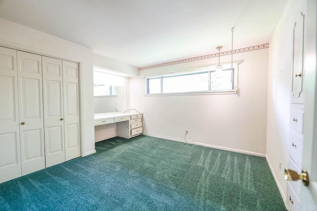 1706 W Block St, El Dorado, AR 71730 - unfurnished bedroom with dark colored carpet, a closet, and baseboards