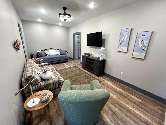 51 Yosemite Dr, Cherokee Village, AR 72529 - living room with wood finished floors, baseboards, and recessed lighting