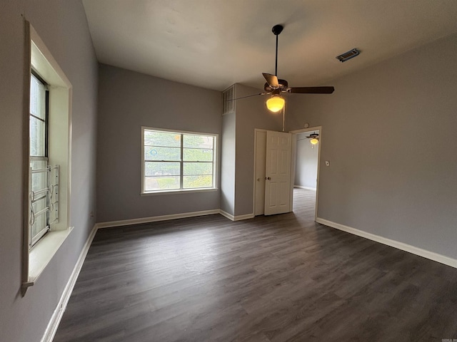 1621 Maple St, North Little Rock, AR 72114 - empty room with a ceiling fan, dark wood finished floors, and baseboards