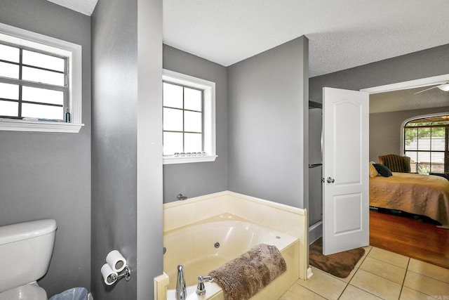 113 Deer View Cir, Hot Springs, AR 71913 - ensuite bathroom featuring tile patterned flooring, a whirlpool tub, toilet, ceiling fan, and an enclosed shower