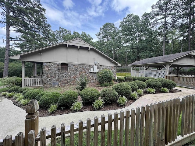 5901 Star Ln, Little Rock, AR 72223 - view of side of home with stone siding and board and batten siding