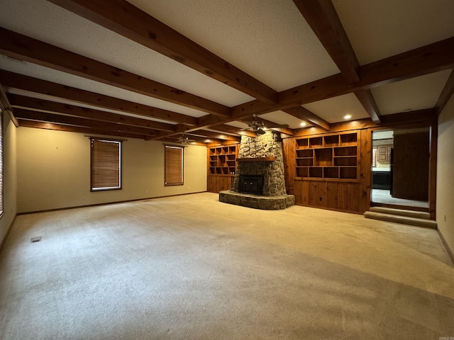 5901 Star Ln, Little Rock, AR 72223 - unfurnished living room featuring beam ceiling, baseboards, carpet floors, a fireplace, and built in features