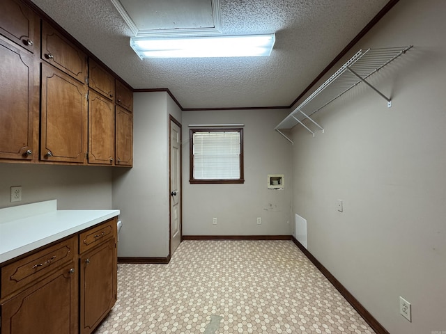 5901 Star Ln, Little Rock, AR 72223 - laundry room featuring a textured ceiling, washer hookup, cabinet space, light carpet, and baseboards