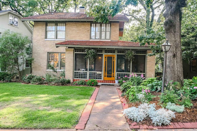 320 Linwood Ct, Little Rock, AR 72205 - view of front facade with a tile roof, brick siding, a front yard, and a chimney