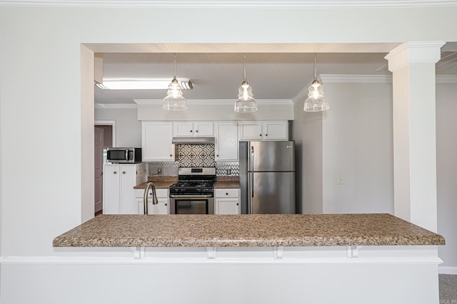 831 Jackman St, Benton, AR 72015 - kitchen featuring appliances with stainless steel finishes, ornamental molding, under cabinet range hood, tasteful backsplash, and white cabinets