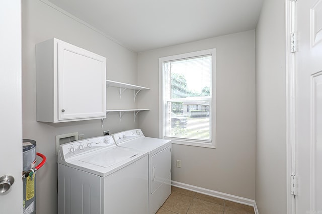 831 Jackman St, Benton, AR 72015 - laundry area featuring cabinet space, washer and dryer, baseboards, and light tile patterned flooring