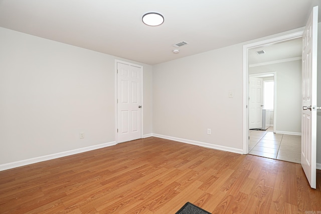 831 Jackman St, Benton, AR 72015 - spare room with light wood-style floors, baseboards, ornamental molding, and a smoke detector